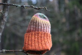 A hand-knit hat of wool, warm and colourful